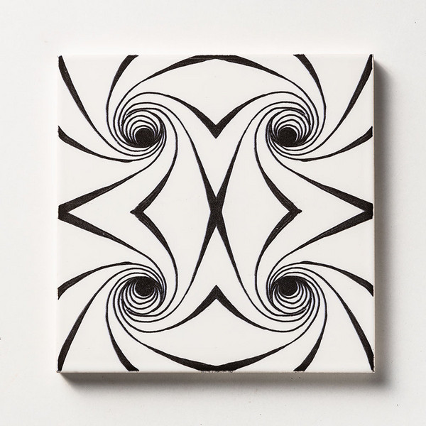 Black twisted glossy ceramic tile with decorative swirl pattern by Country Floors