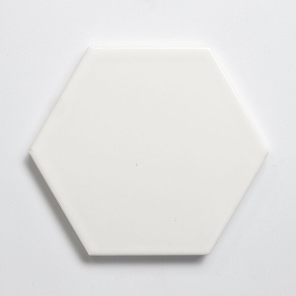 White glossy ceramic hexagon tile for luxury bar interiors by Country Floors