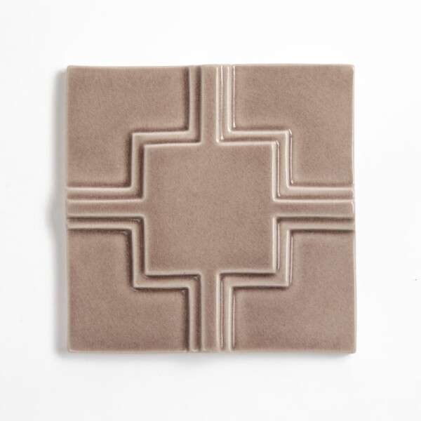 Loto crackled ceramic accent tile in warm taupe with geometric relief pattern by Country Floors