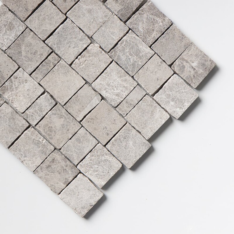 Corner-angle view of Maroon Di Notte Leather Scarpa Rough Cut Marble Mosaic sheet, showing how light plays across the soft, low-sheen leather finish and emphasizes the depth of the rough-cut pattern.