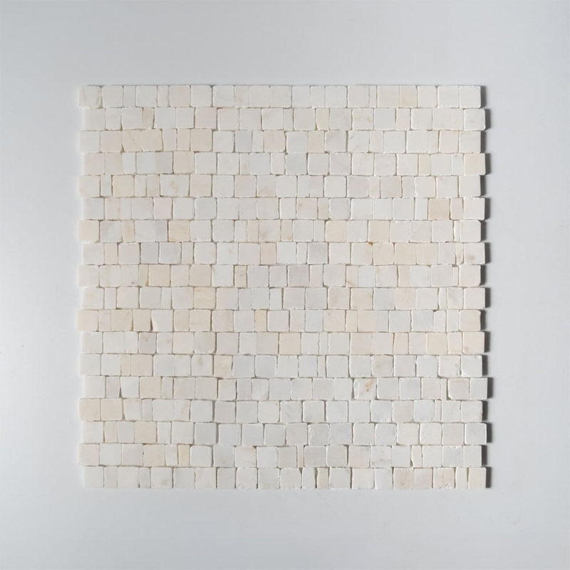 Calacatta Amber Honed Scarpa Rough Cut Marble Mosaic sheet shown from directly above, displaying the full staggered pattern of hand-clipped rectangular white marble pieces with warm amber-gold veining across a 12x12 inch panel.