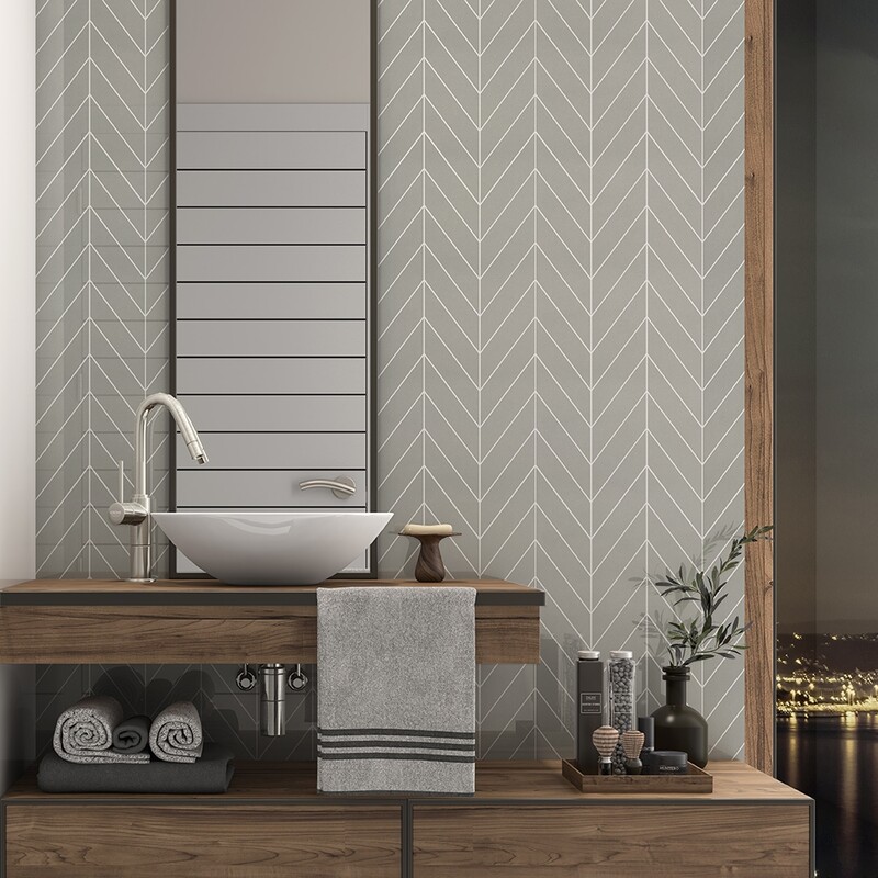 modern bathroom vanity area with chevron tile backsplash and warm wood accents by Country Floors