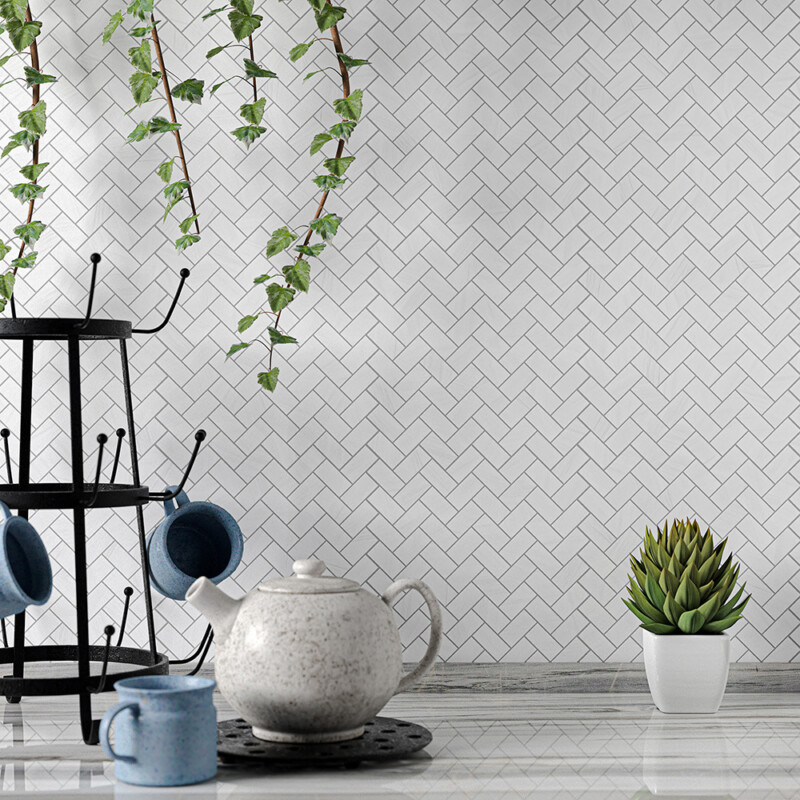 Aspen White polished herringbone marble mosaic backsplash in a light modern kitchen by Country Floors