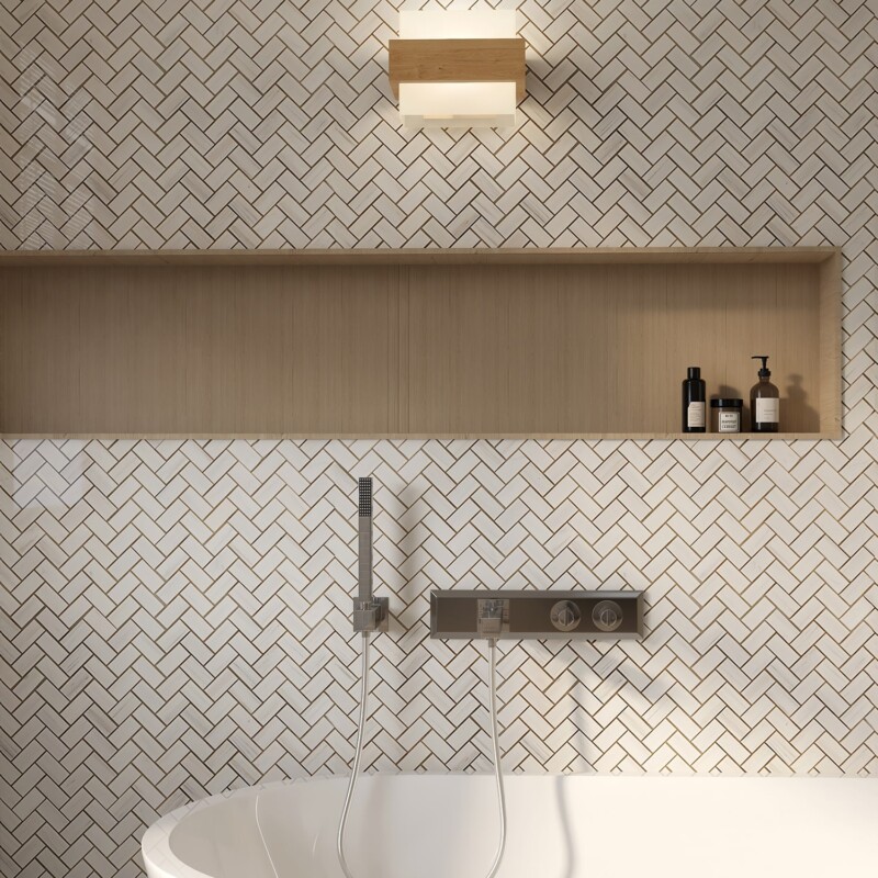 Bathroom wall with herringbone marble mosaic creating refined geometric textured design by Country Floors