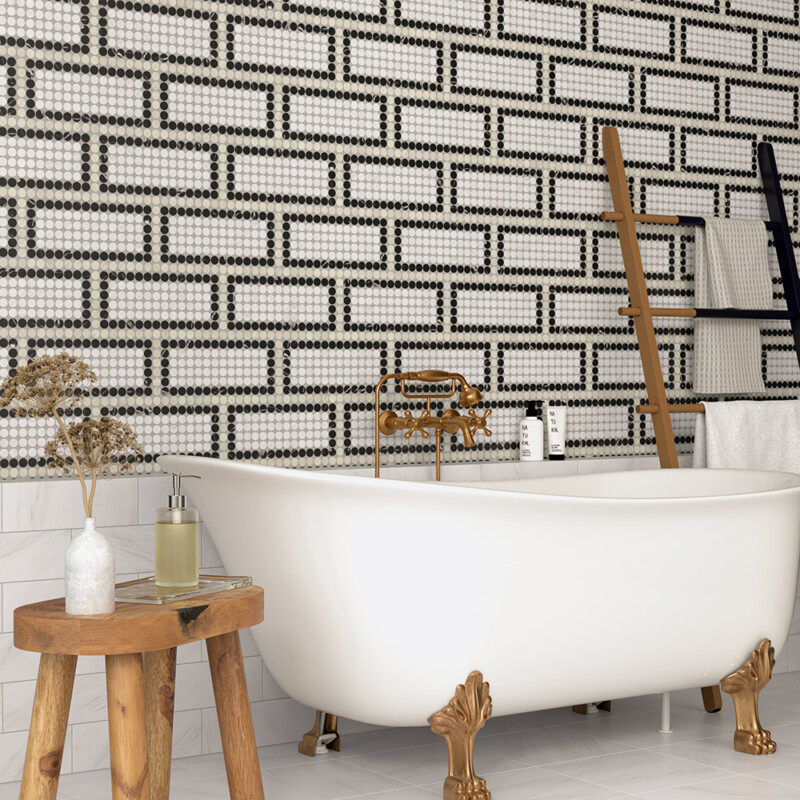 Bathroom wall with black white penny mosaic creating bold geometric visual effect by Country Floors