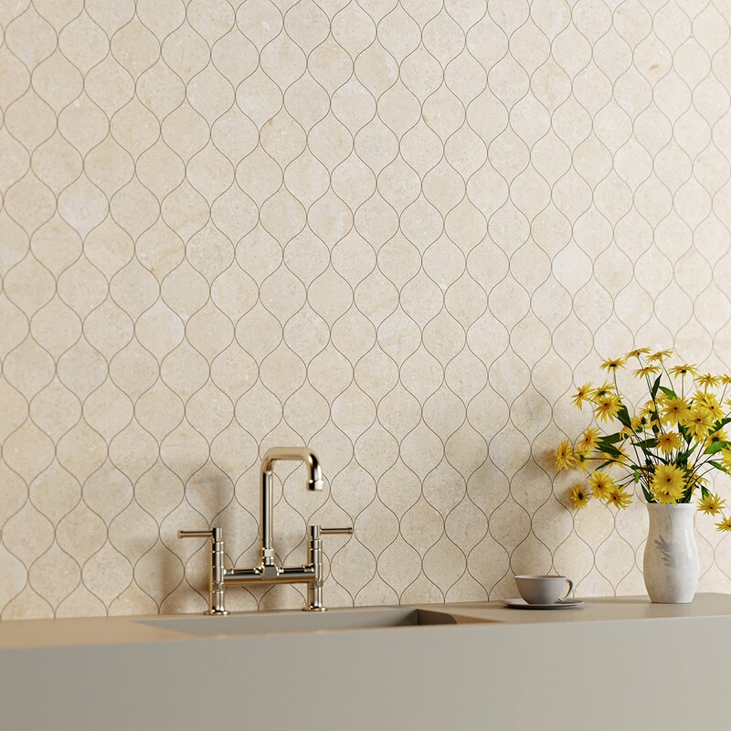 Winter leaf limestone tile backsplash in a bright elegant kitchen by Country Floors