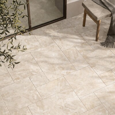 Living space with marble flooring and warm neutral interior styling by Country Floors