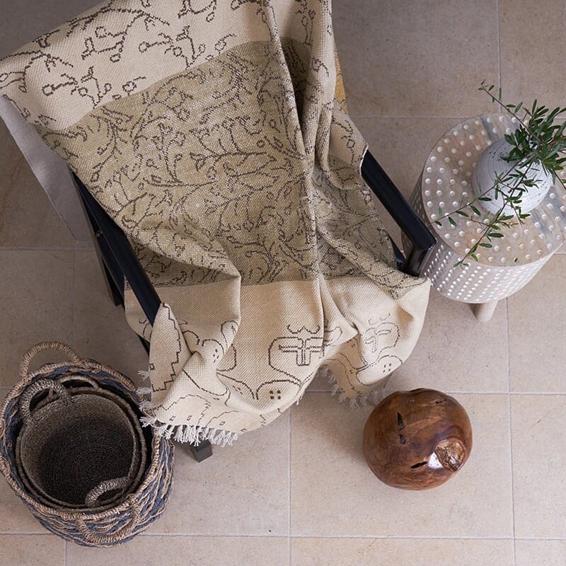 Cozy interior with beige limestone flooring creating warm natural living atmosphere by Country Floors