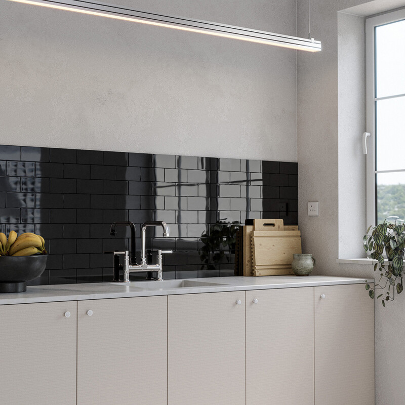 Black glossy subway ceramic tile backsplash in modern kitchen by Country Floors