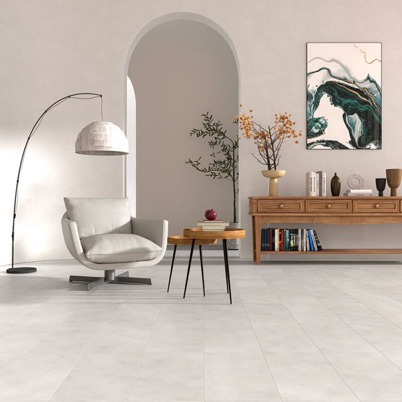 Minimal living space with white porcelain tile flooring and soft neutral decor by Country Floors