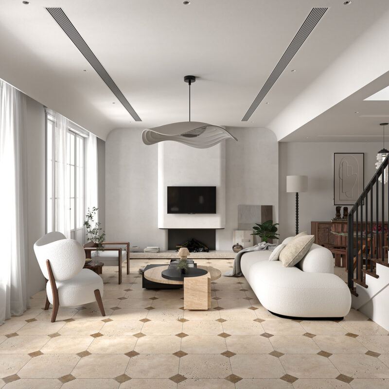 Tumbled travertine tile flooring in an elegant contemporary living room by Country Floors