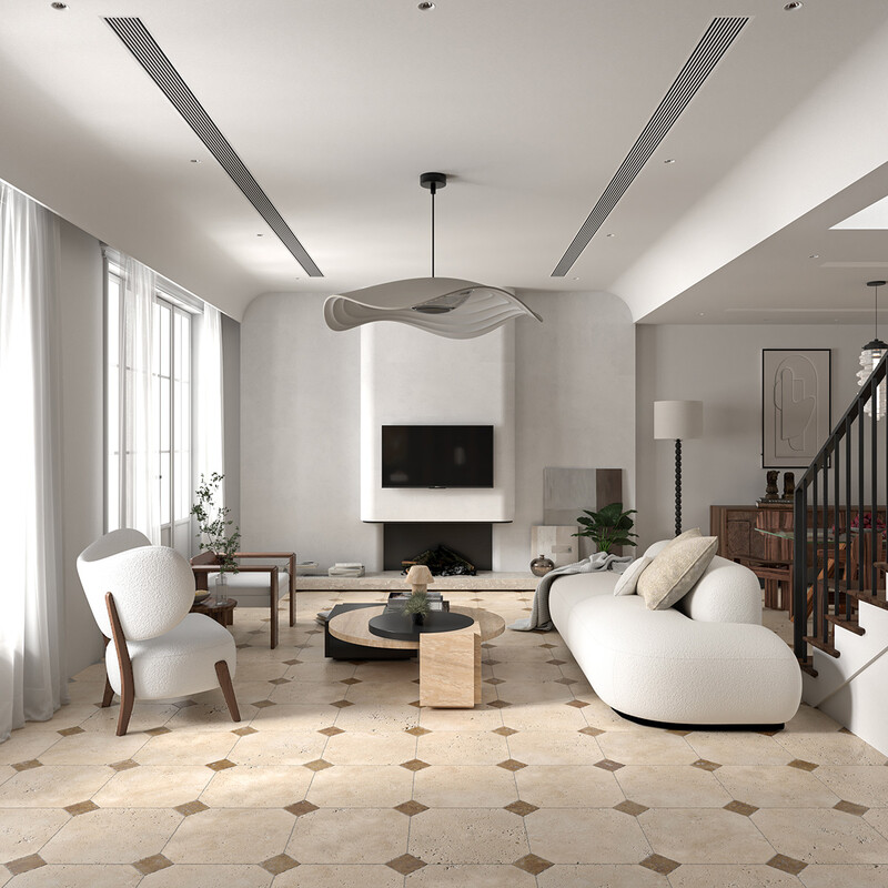 Tumbled travertine tile flooring in an elegant contemporary living room by Country Floors
