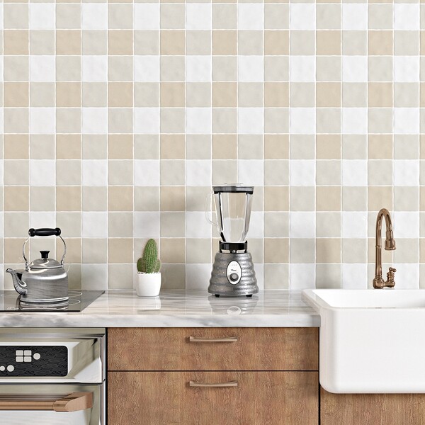 Glossy ceramic square tile backsplash in soft butter and sand tones in a modern kitchen by Country Floors