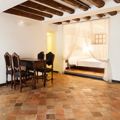 Reclaimed matte square terracotta tile floor in a traditional Spanish style interior by Country Floors