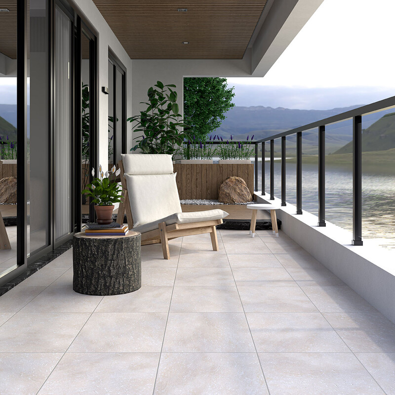 Modern terrace with limestone flooring and open view creating airy elegant space by Country Floors