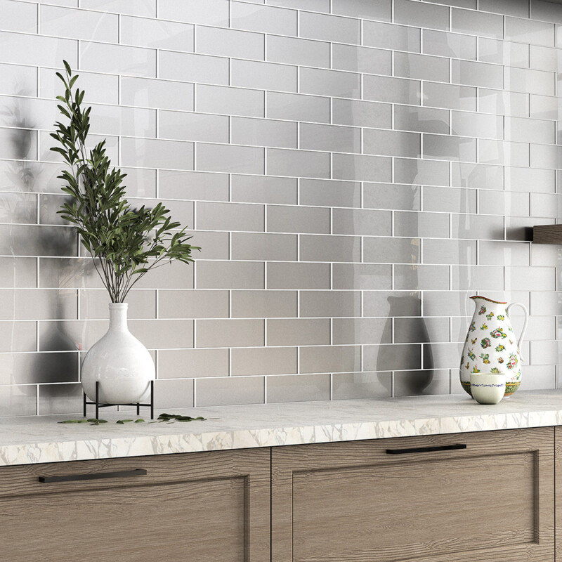 Nickel metallic subway glass tile backsplash in a refined modern kitchen by Country Floors