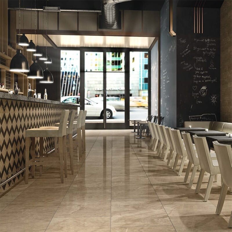 Restaurant interior flooring with marble look porcelain tiles and warm ambient lighting by Country Floors