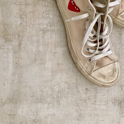Close up of concrete look porcelain floor texture with modern lifestyle styling by Country Floors