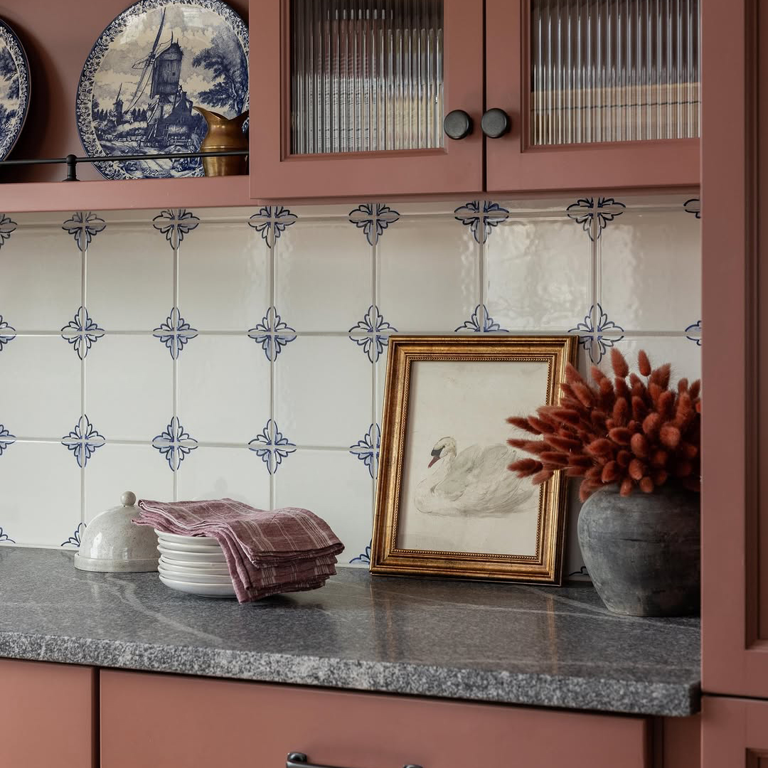 hand painted ceramic tile backsplash design on a cottagecore kitchen
