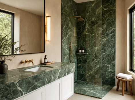 Green honed marble tile walk in shower and vanity countertop in a modern Los Angeles bathroom.