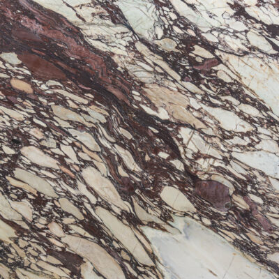 Marble slab photo featuring natural veins of a burgundy / calacatta viola marble