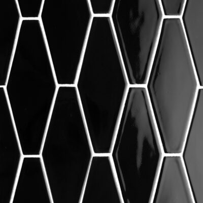 A wall photo featuring black ceramic tiles in long hexagon layout.