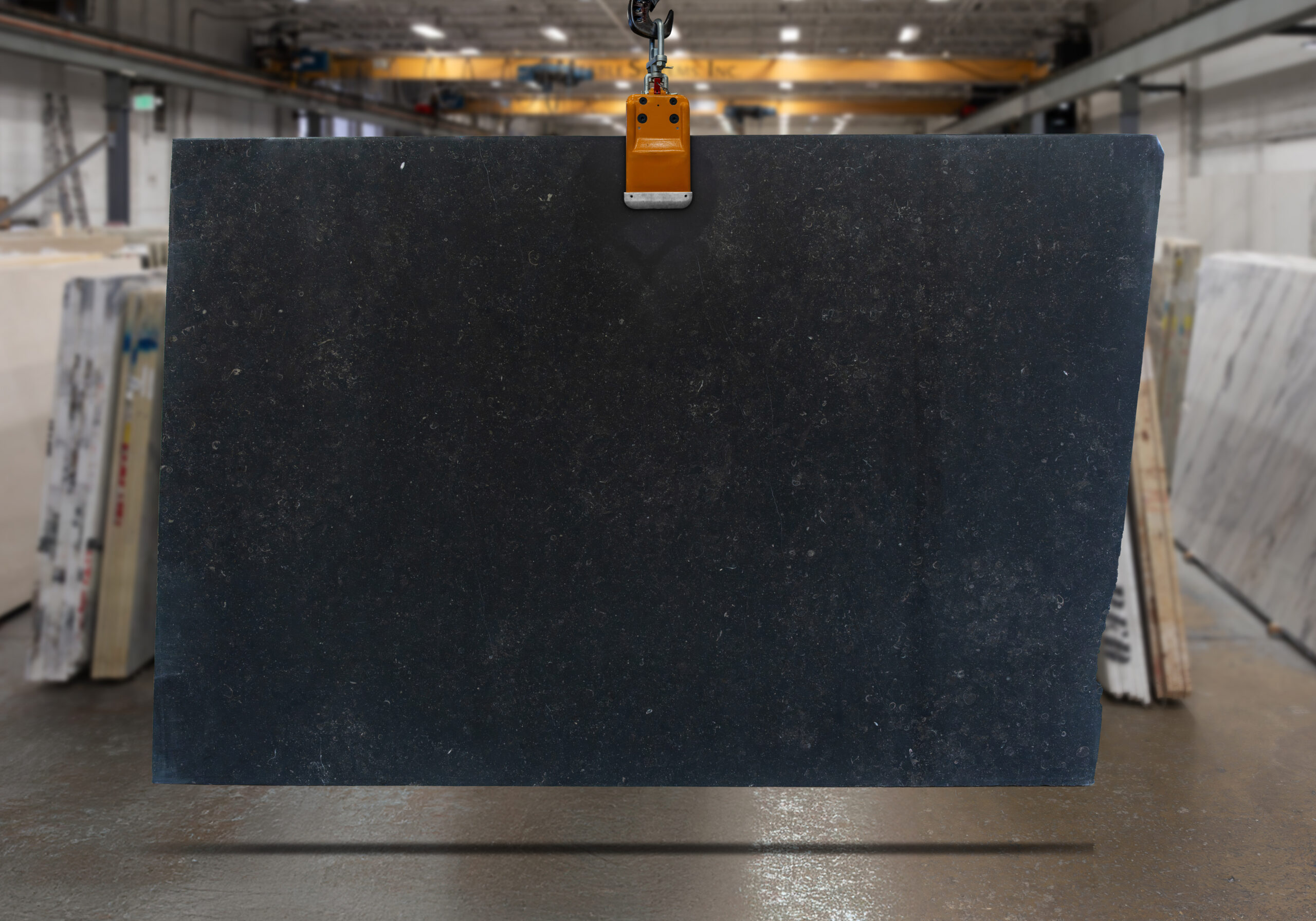 Featuring black marble slab in a slab yard.