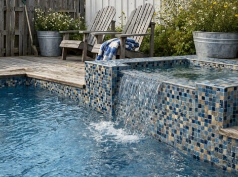Blue polished glass mosaic pool tiles in a Pompano Beach backyard.