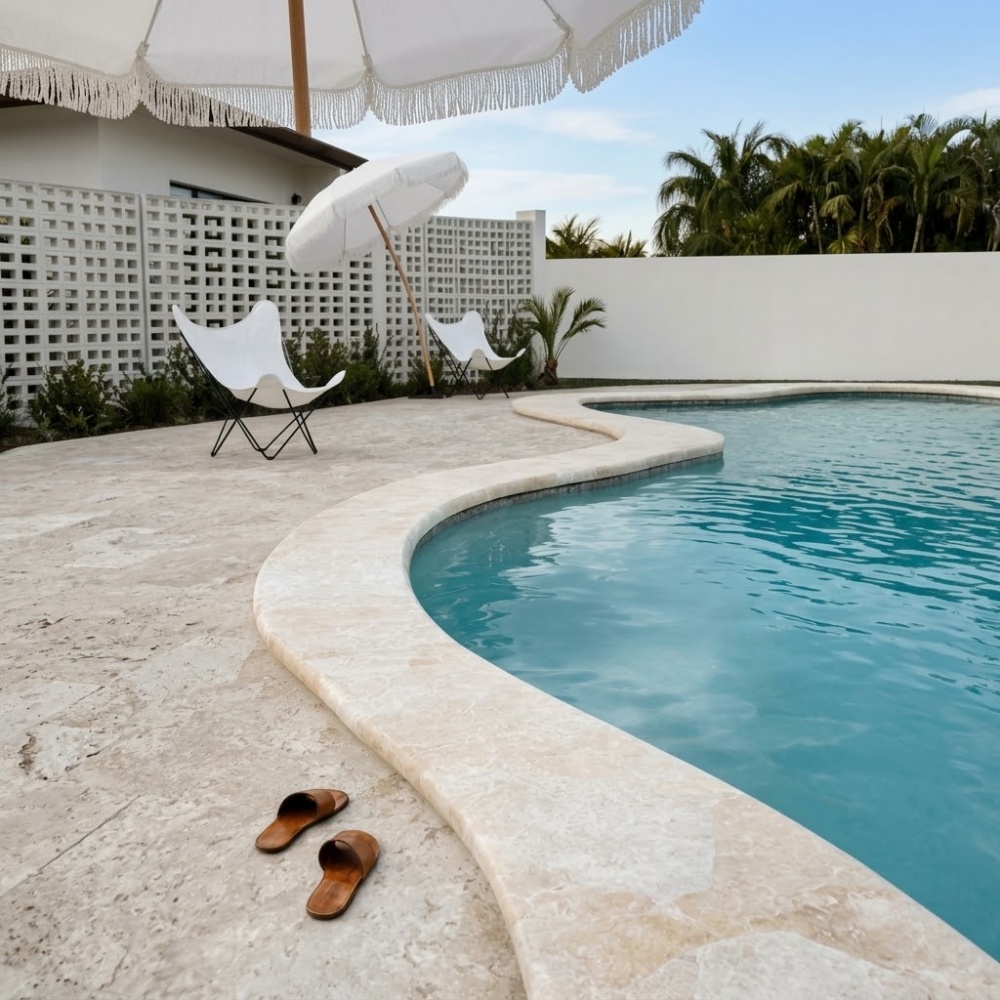 Diana Royal tumbled marble pool coping in Pompano Beach.